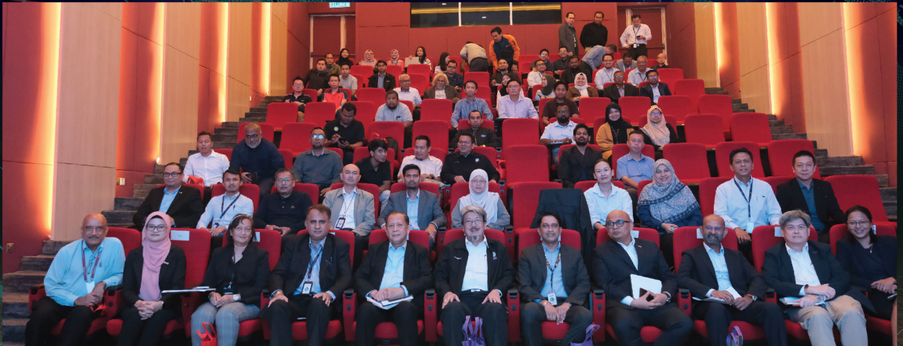 Group photograph of attendees seated in an auditorium at the MBOT event on 25 November 2025